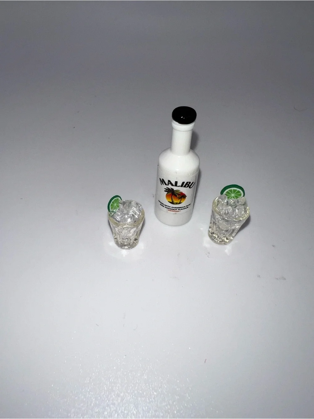 Miniature Malibu and set of drinking glasses